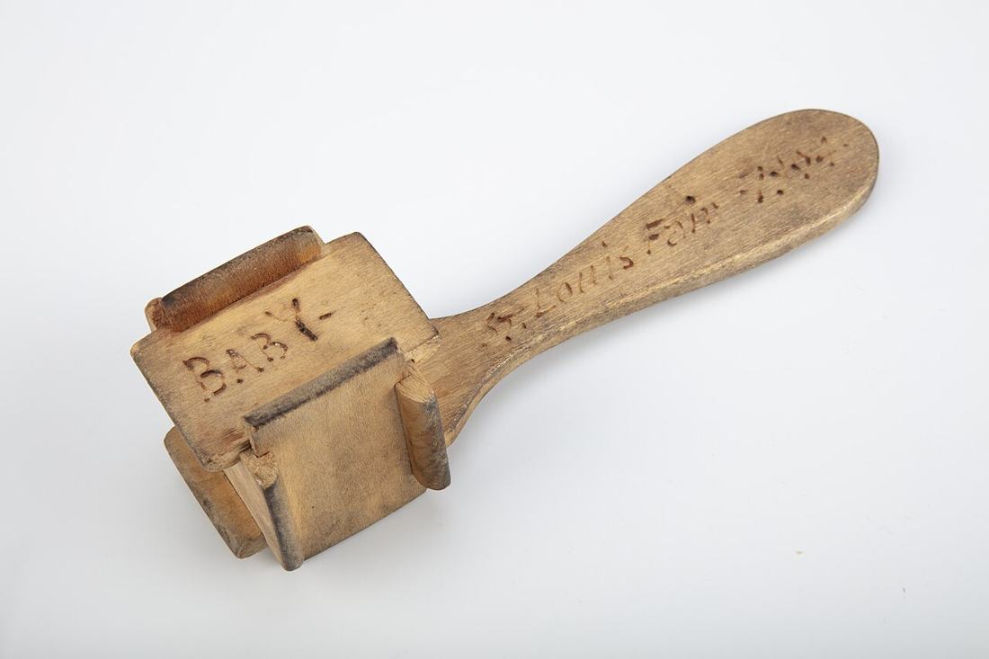 A wooden baby rattle