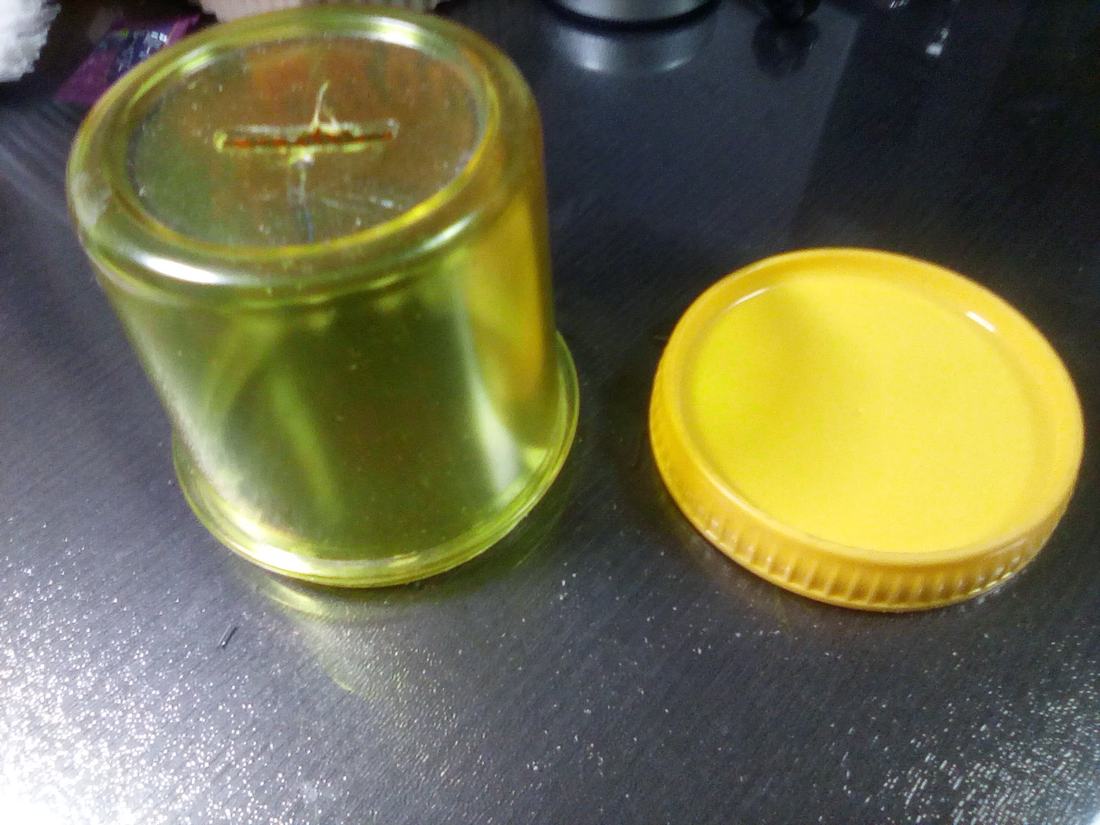 A money box with its cover beside it
